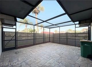 152 Lake Point Lane, Unit 4A Naples, FL 34112 - Photo 3 of 15 a view of outdoor space with wooden fence