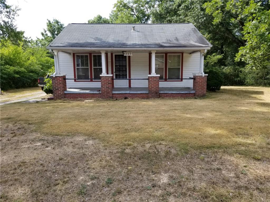 217 Burnett Ferry Road Southwest Rome, GA 30165 - Photo 1 of 1 a front view of a house with garden