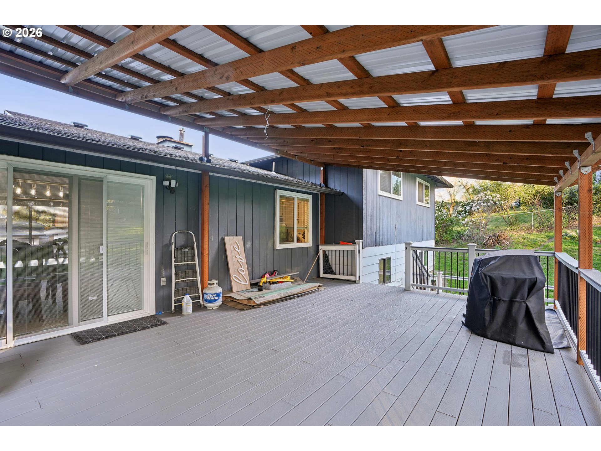 3454 Northeast 5th Court Gresham, OR 97030 - Photo 31 of 34 a view of backyard with chairs and wooden floor