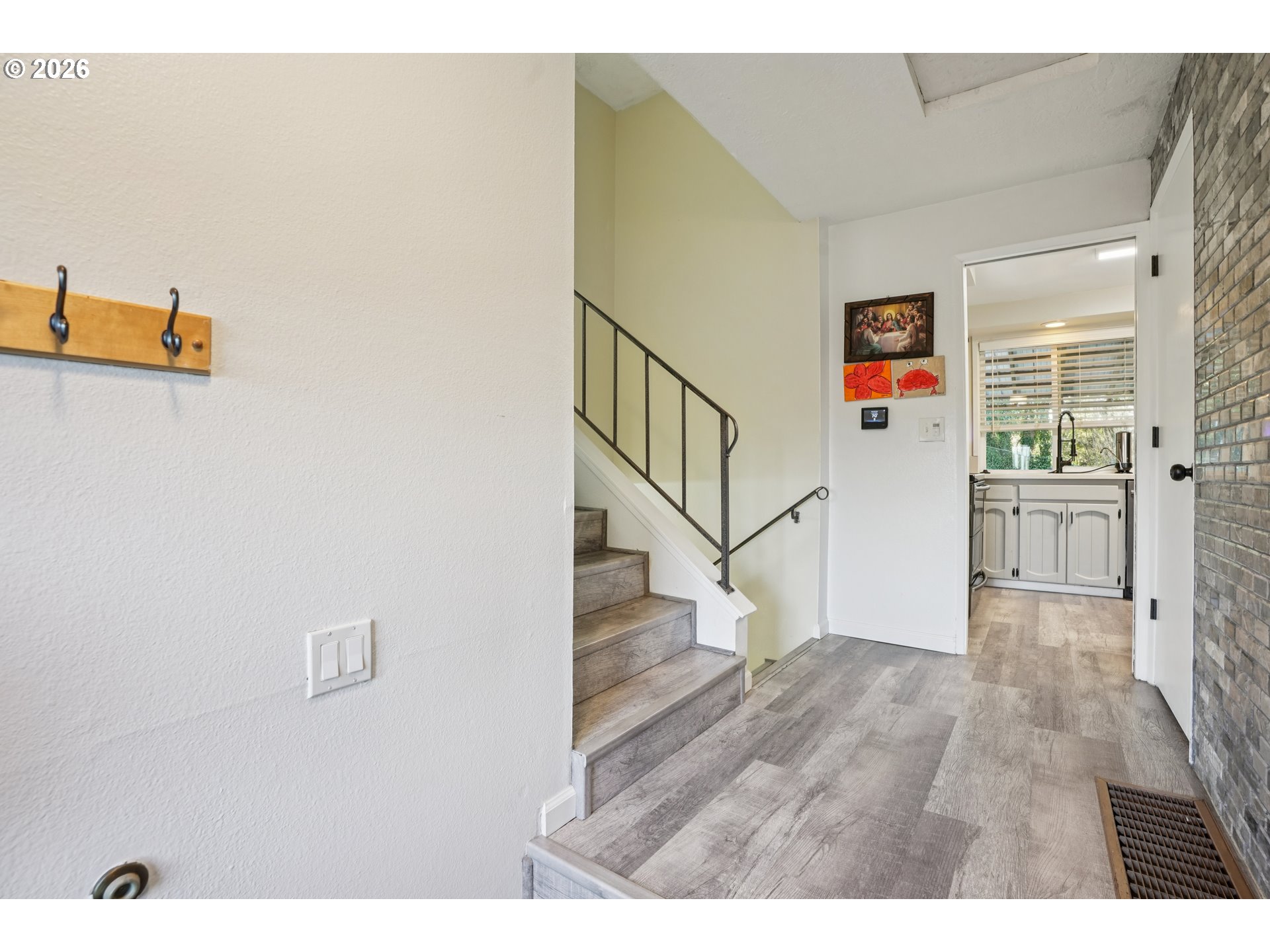 3454 Northeast 5th Court Gresham, OR 97030 - Photo 5 of 34 a view of a hallway with wooden floor and entryway
