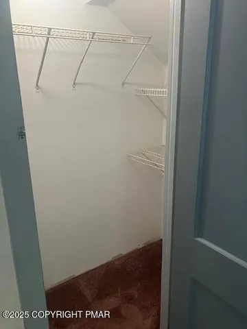 a view of small space with racks on the wall