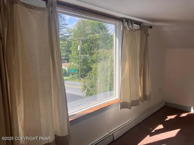 a view of a room that has a large window