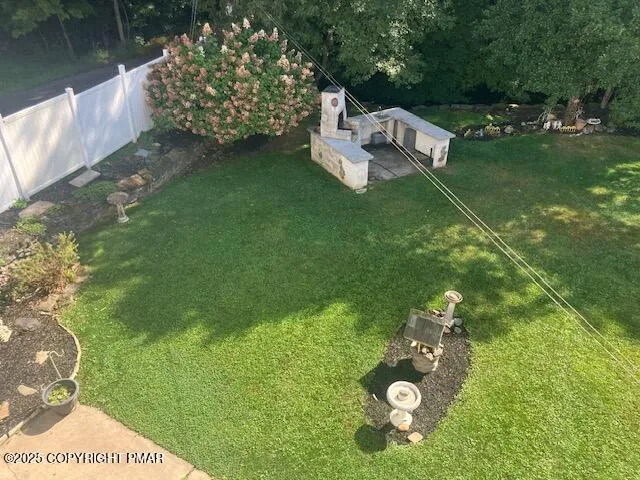 a backyard of a house with lots of green space