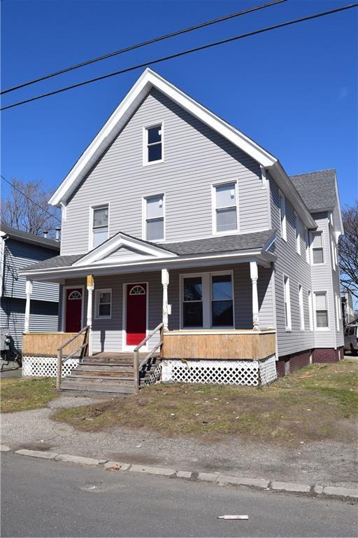 71 Adams Street Bridgeport, CT 06607 - Photo 1 of 1 a front view of a house with windows
