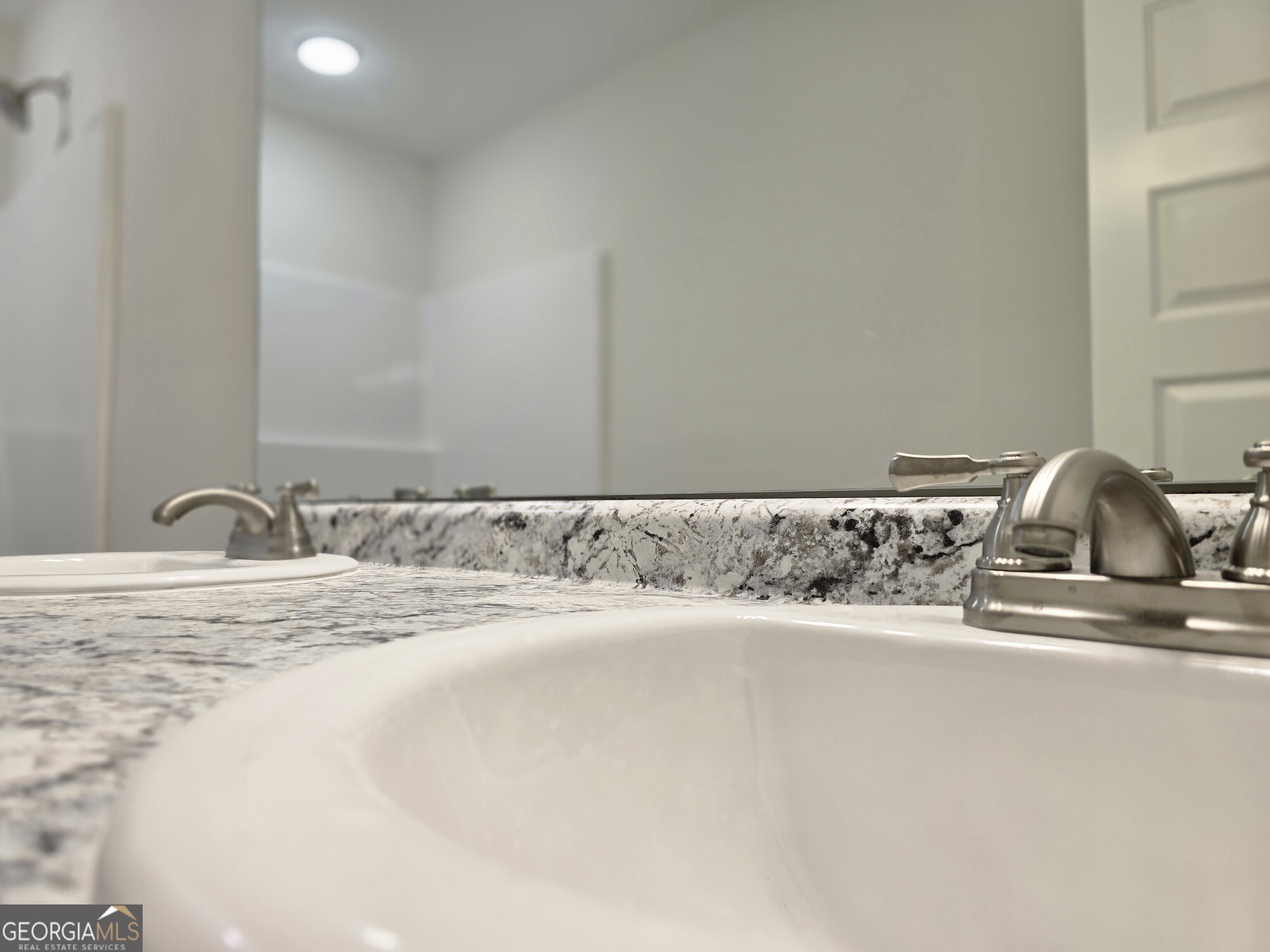 26466 Turner Road Metter, GA 30439 - Photo 16 of 39 a bathroom with a sink and a mirror