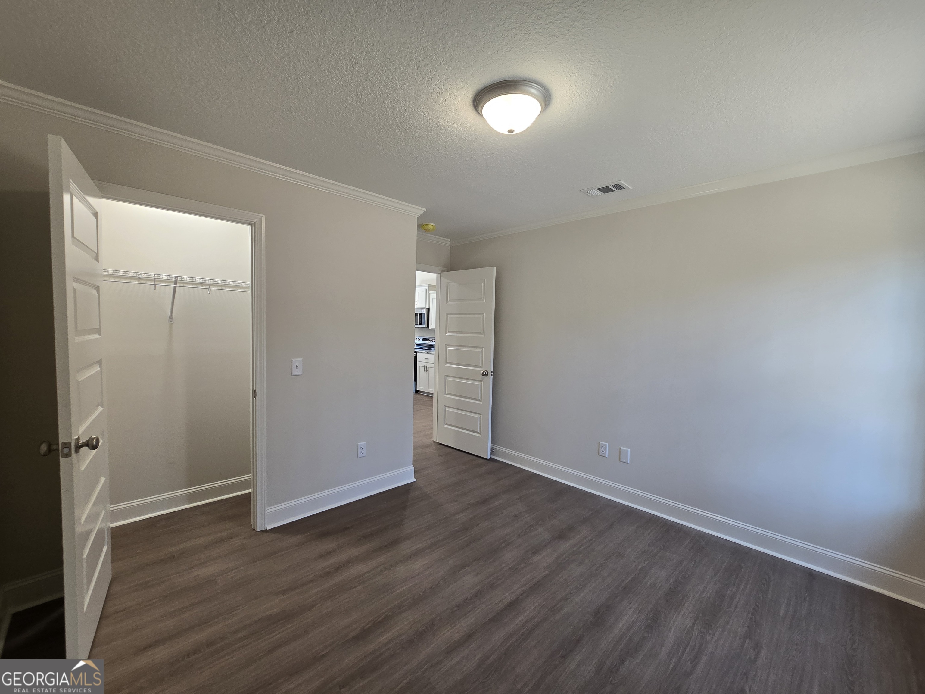 26466 Turner Road Metter, GA 30439 - Photo 23 of 39 wooden floor in an empty room with a window