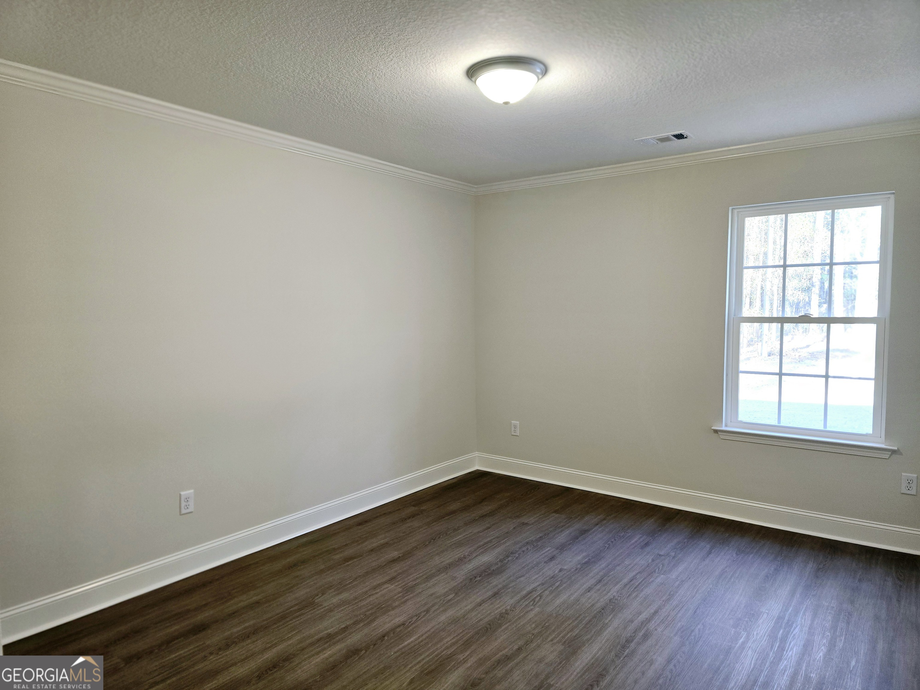 26466 Turner Road Metter, GA 30439 - Photo 25 of 39 wooden floor in an empty room with a window