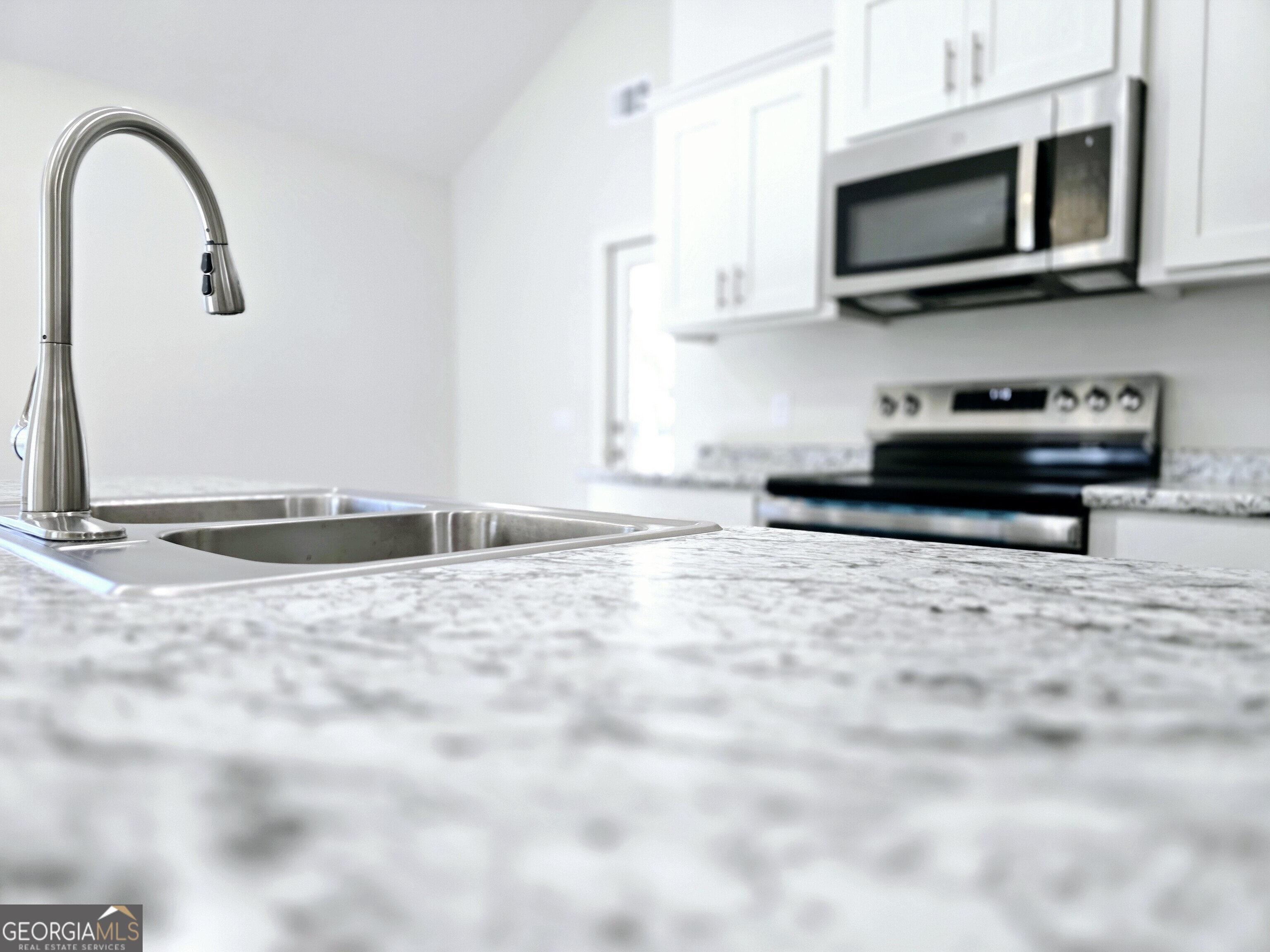 26466 Turner Road Metter, GA 30439 - Photo 27 of 39 a view of kitchen sink and microwave