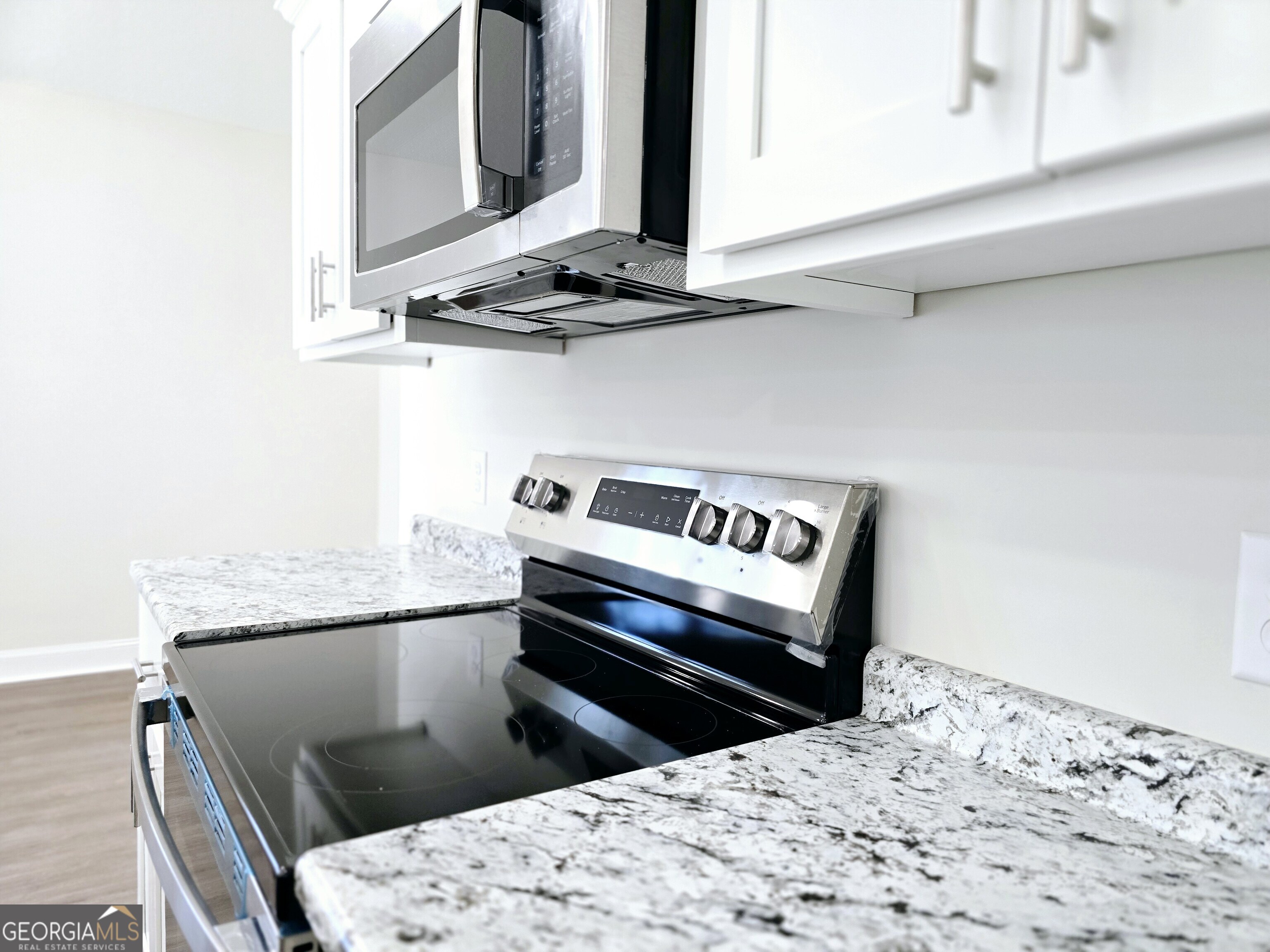 26466 Turner Road Metter, GA 30439 - Photo 28 of 39 a kitchen with a stove and a microwave