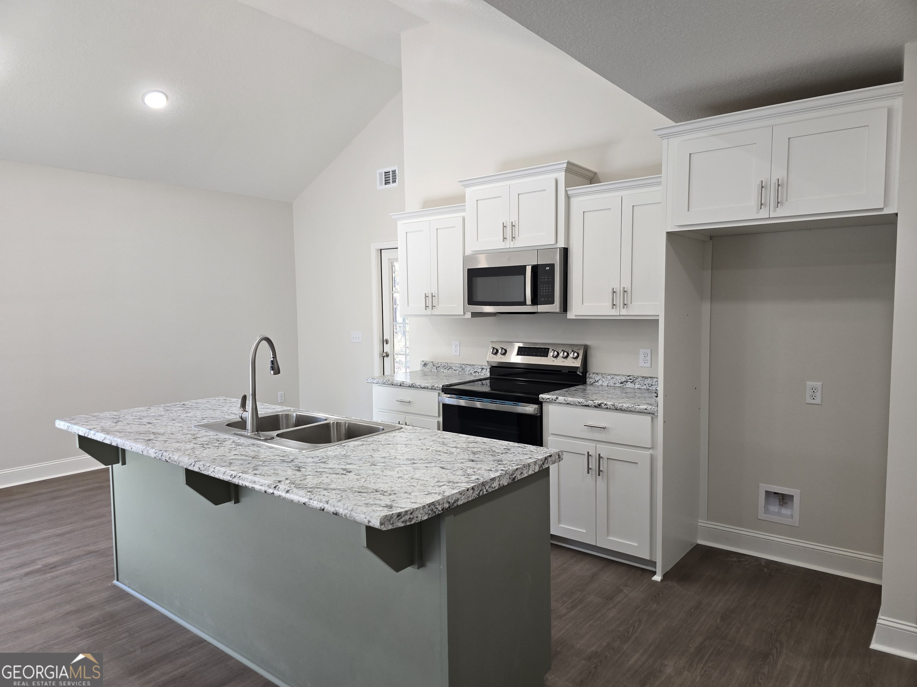 26466 Turner Road Metter, GA 30439 - Photo 30 of 39 a kitchen with granite countertop a sink stove and refrigerator