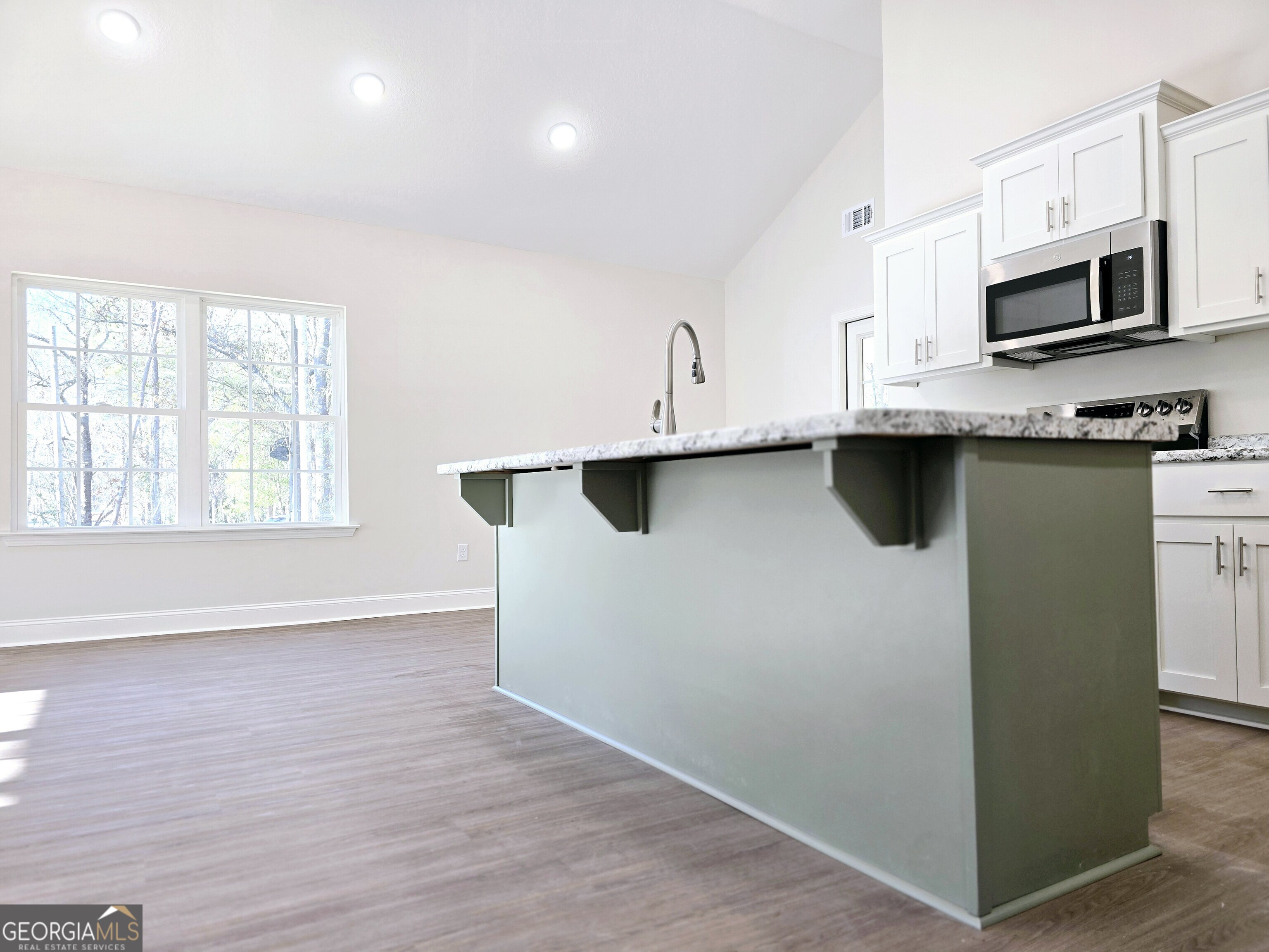 26466 Turner Road Metter, GA 30439 - Photo 31 of 39 a kitchen with stainless steel appliances a sink a stove and microwave