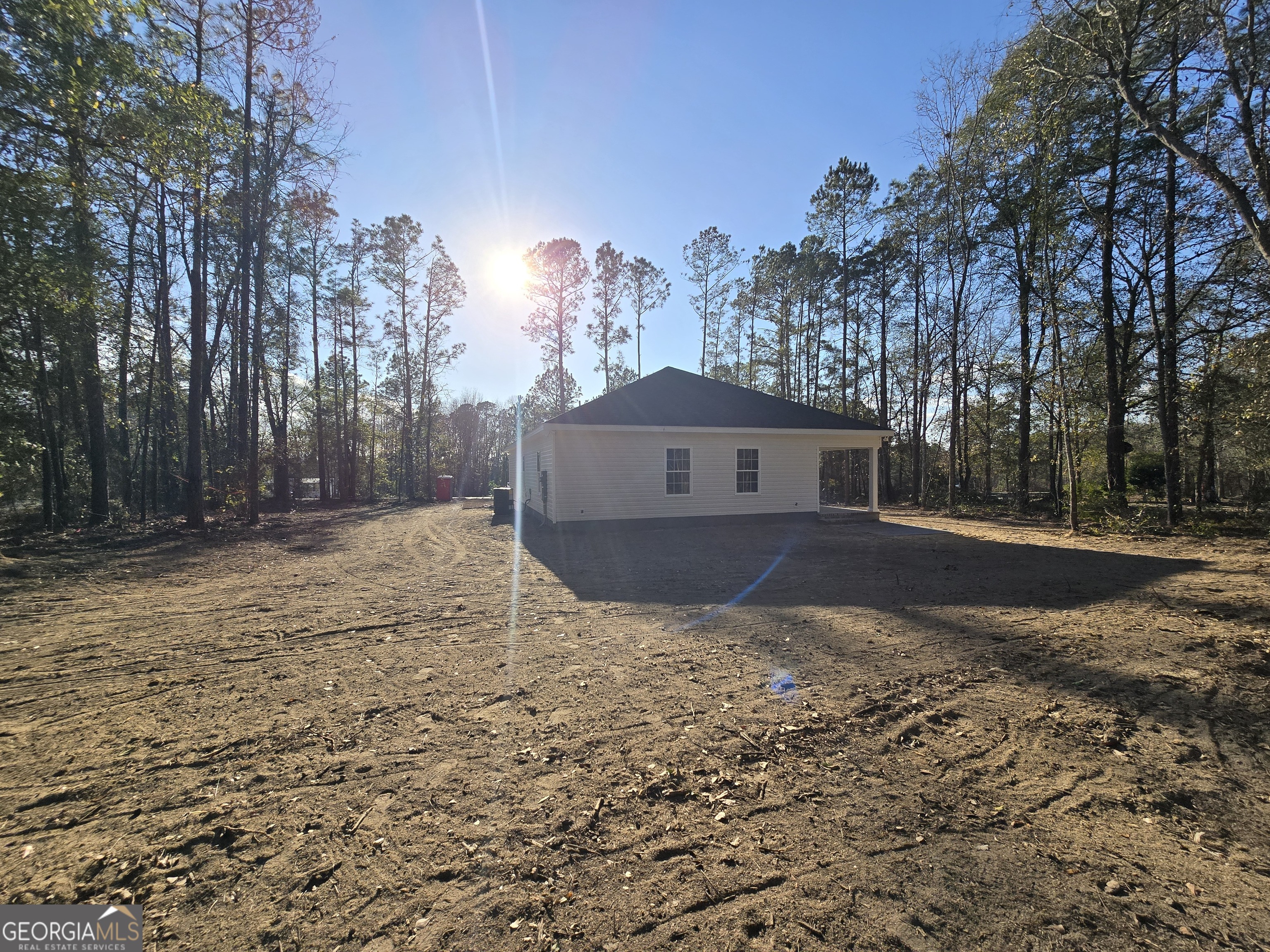 26466 Turner Road Metter, GA 30439 - Photo 36 of 39 a view of a house with a yard