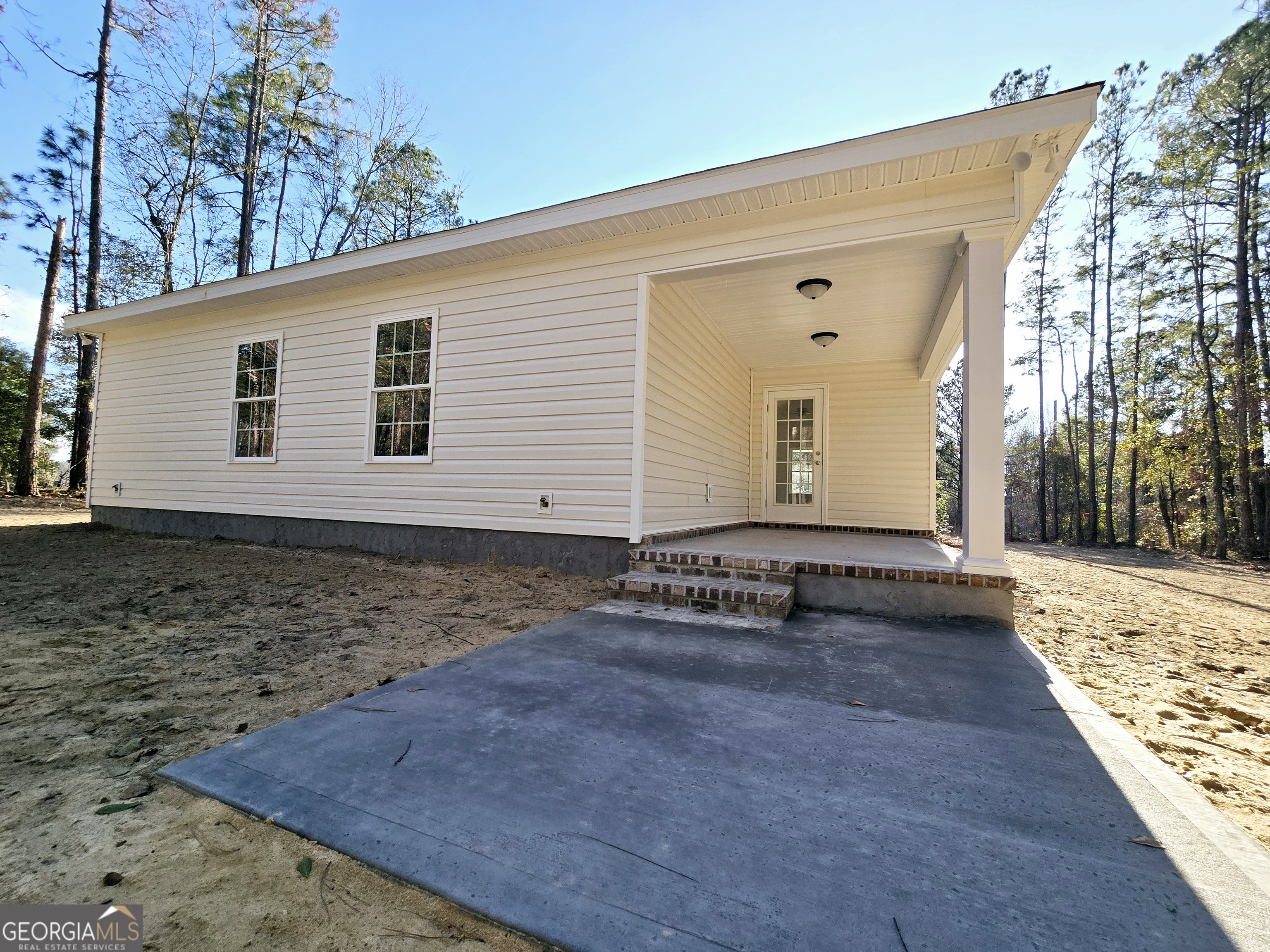 26466 Turner Road Metter, GA 30439 - Photo 37 of 39 a view of a house with backyard and trees