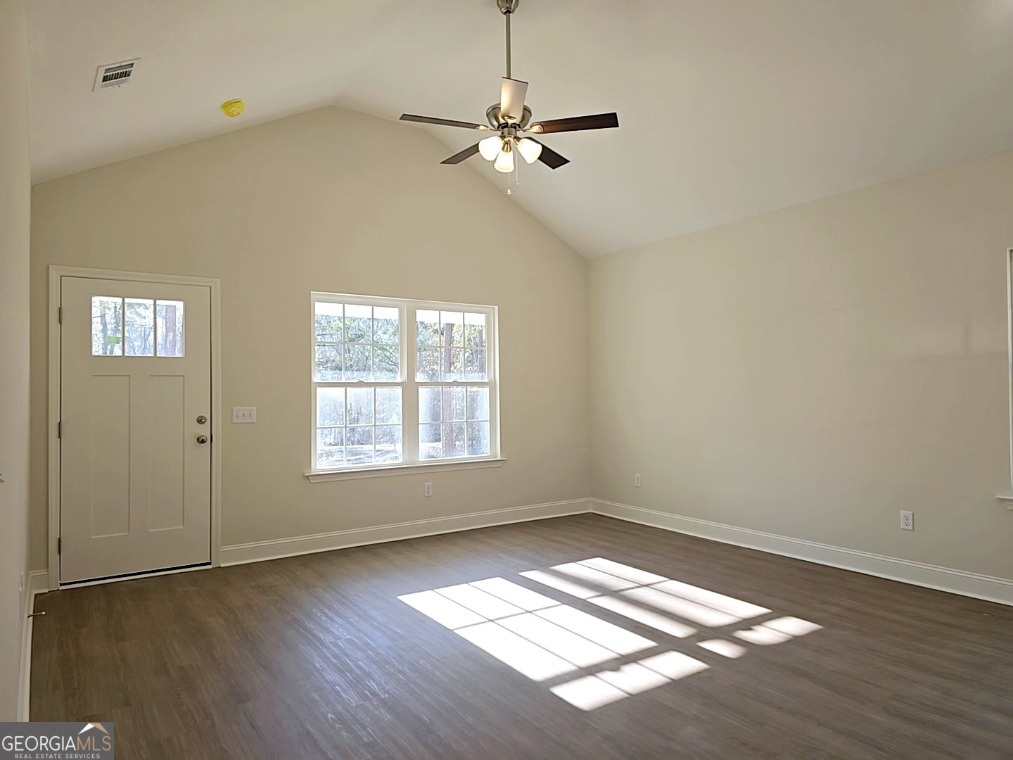 26466 Turner Road Metter, GA 30439 - Photo 4 of 39 wooden floor in an empty room with a window