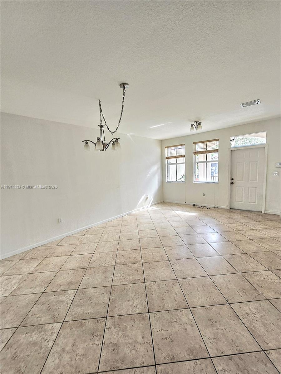 988 Southwest 154th Path Miami, FL 33194 - Photo 13 of 31 a view of an empty room with windows