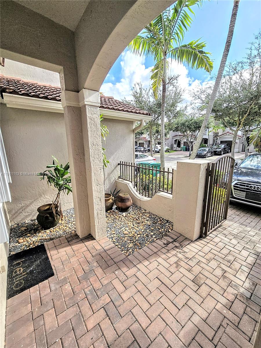 988 Southwest 154th Path Miami, FL 33194 - Photo 7 of 31 a view of balcony with wooden floor and outdoor seating