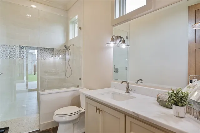 an empty room with a window and a ceiling fan