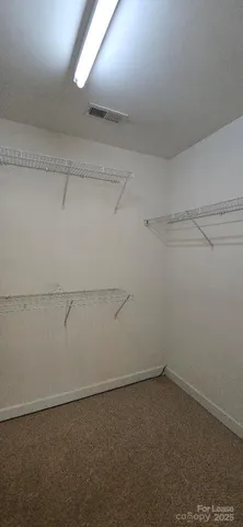 a view of a room with racks on the wall
