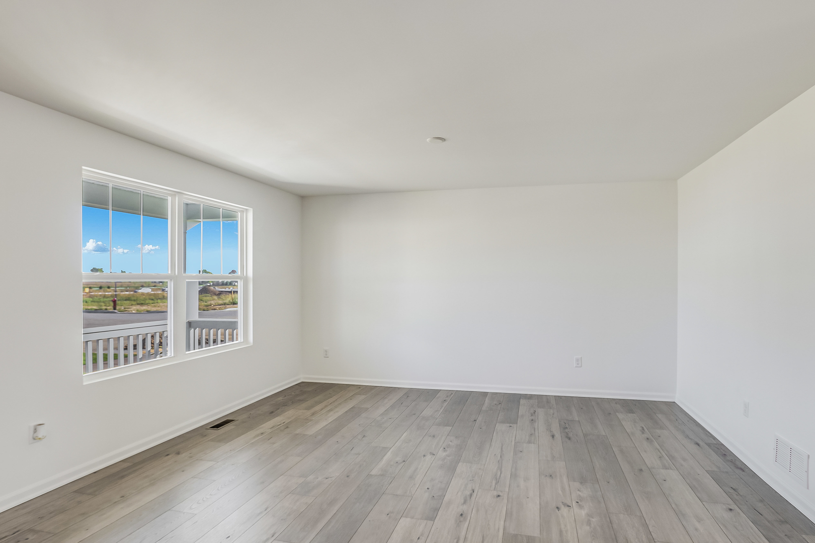 488 Endicott Road South Elgin, IL 60177 - Photo 3 of 30 wooden floor in an empty room with a window