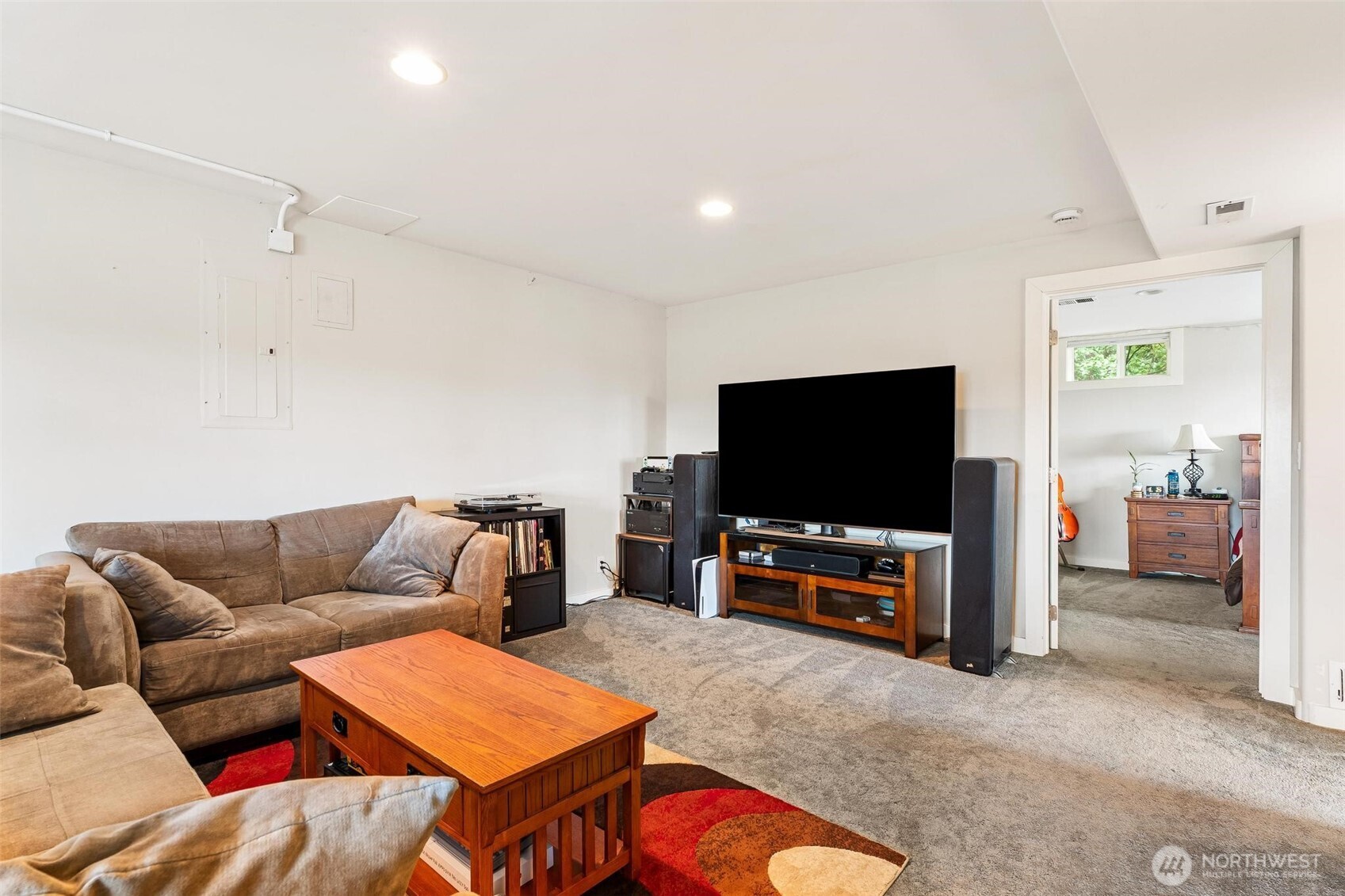 5162 South Wallace Street Seattle, WA 98178 - Photo 24 of 37 a living room with furniture and a flat screen tv