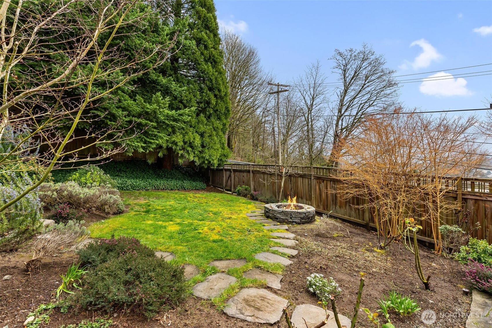 5162 South Wallace Street Seattle, WA 98178 - Photo 30 of 37 a backyard of a house with lots of green space
