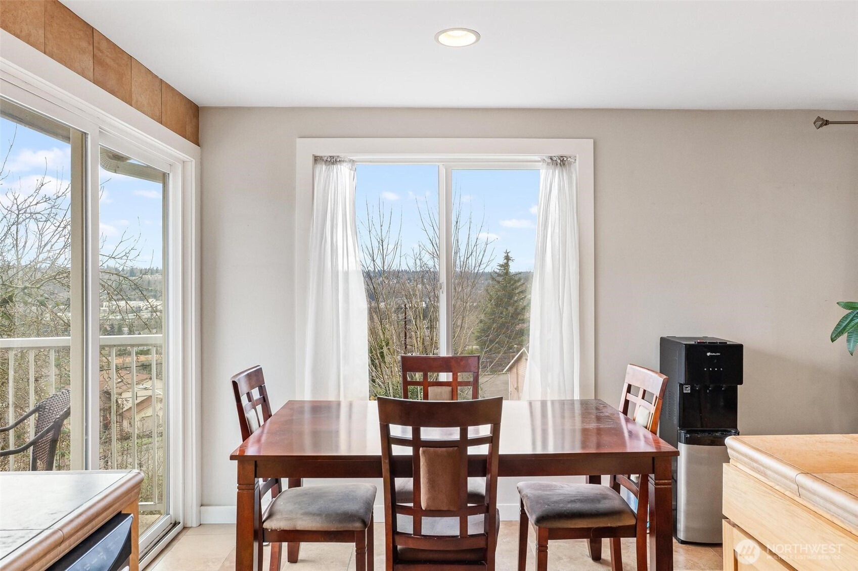 5162 South Wallace Street Seattle, WA 98178 - Photo 10 of 37 a view of a dining room with furniture window and wooden floor