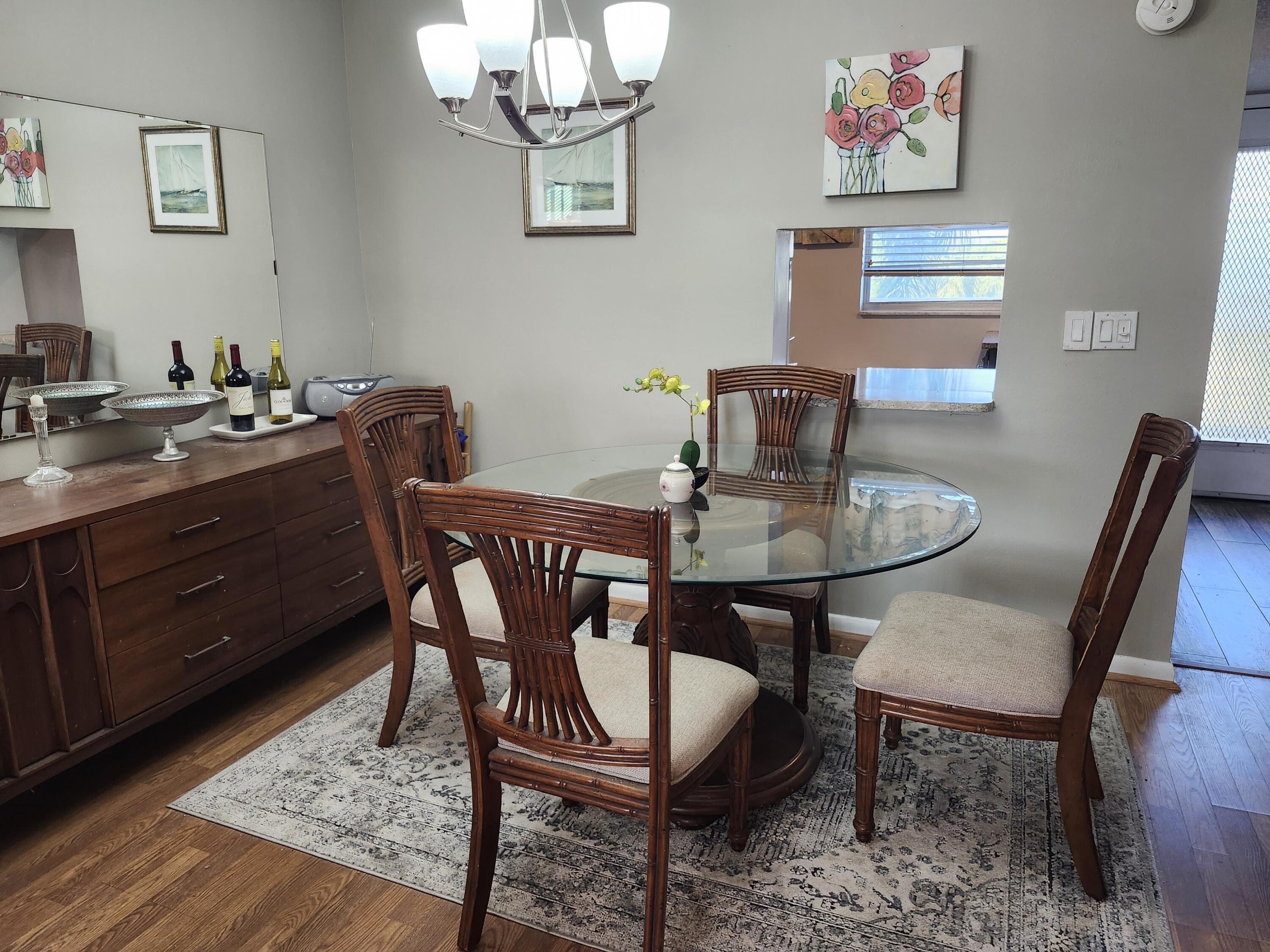 300 Northeast 26th Avenue, Unit 305 Boynton Beach, FL 33435 - Photo 11 of 54 a view of a dining room with furniture