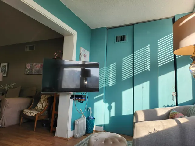 a living room with furniture and a window