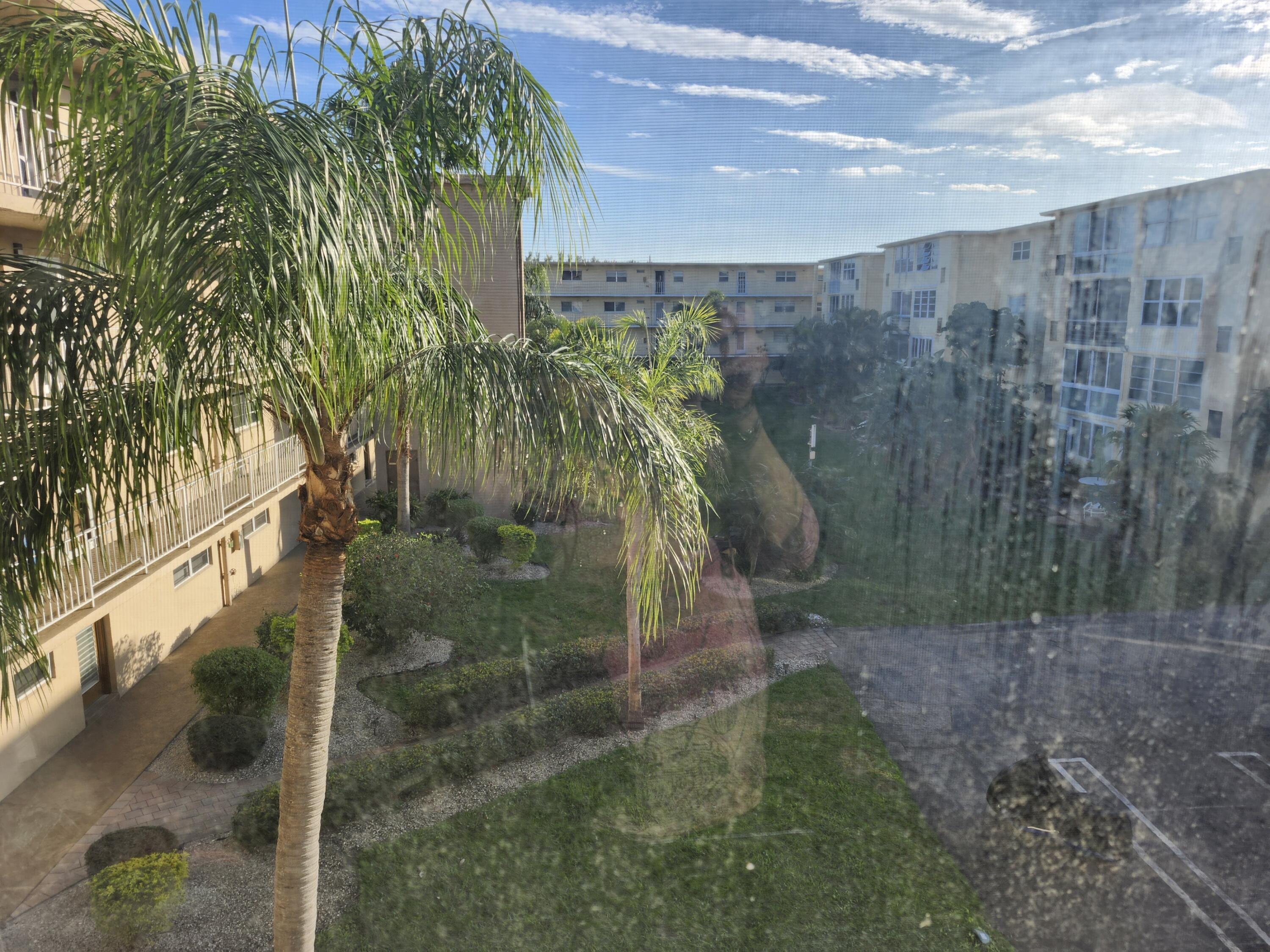 300 Northeast 26th Avenue, Unit 305 Boynton Beach, FL 33435 - Photo 16 of 54 a view of outdoor space and yard