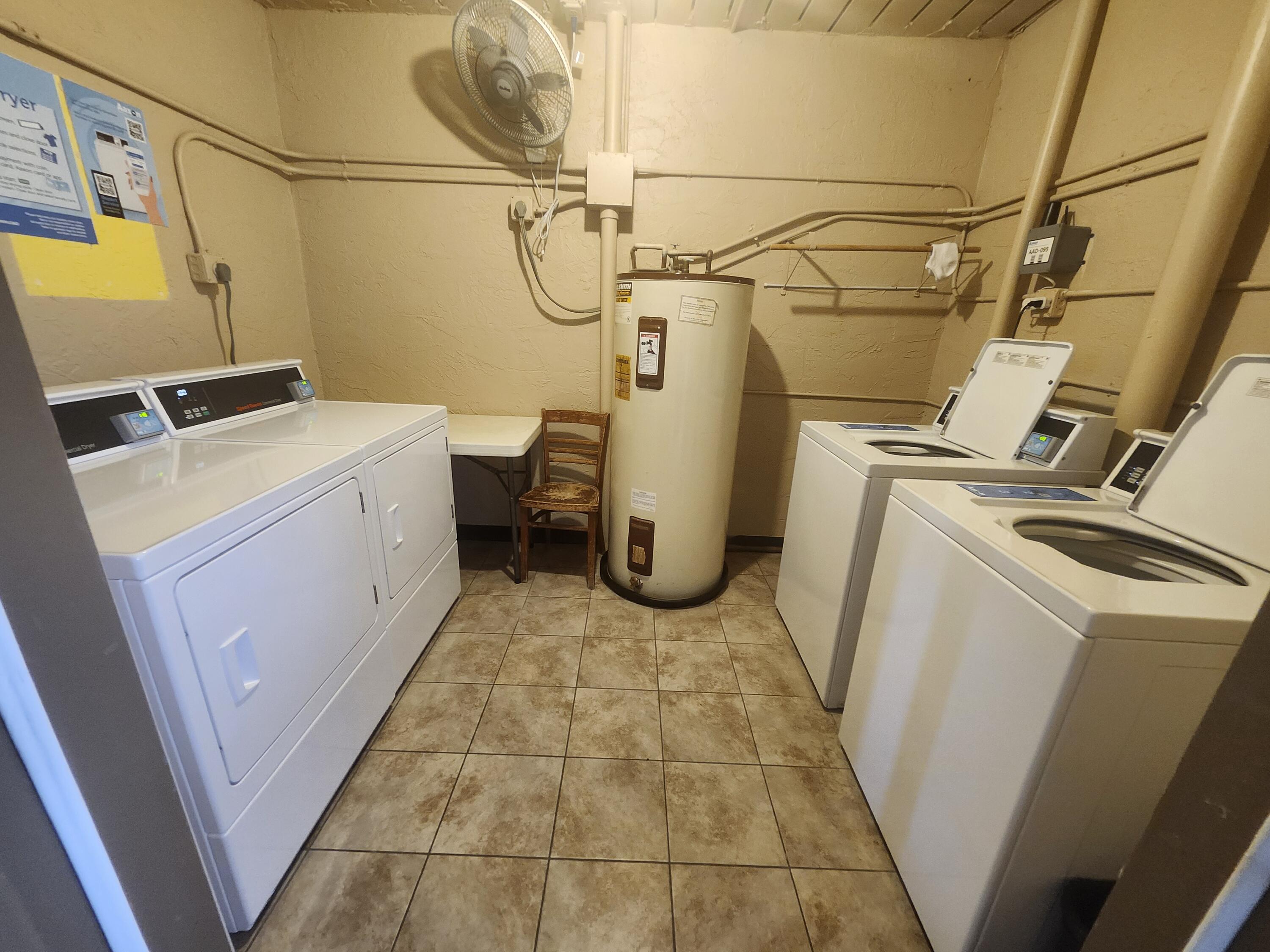 300 Northeast 26th Avenue, Unit 305 Boynton Beach, FL 33435 - Photo 25 of 54 a utility room with dryer and washer