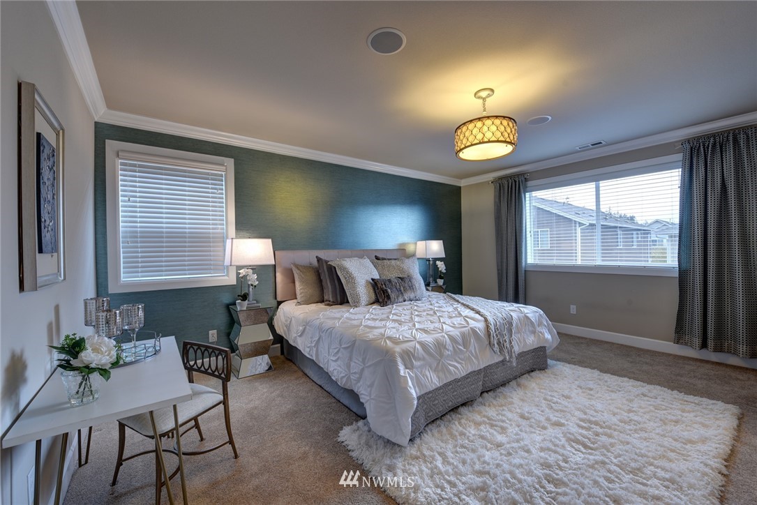 4130 174th Street Southeast Bothell, WA 98012 - Photo 15 of 29 a bedroom with a bed and a window