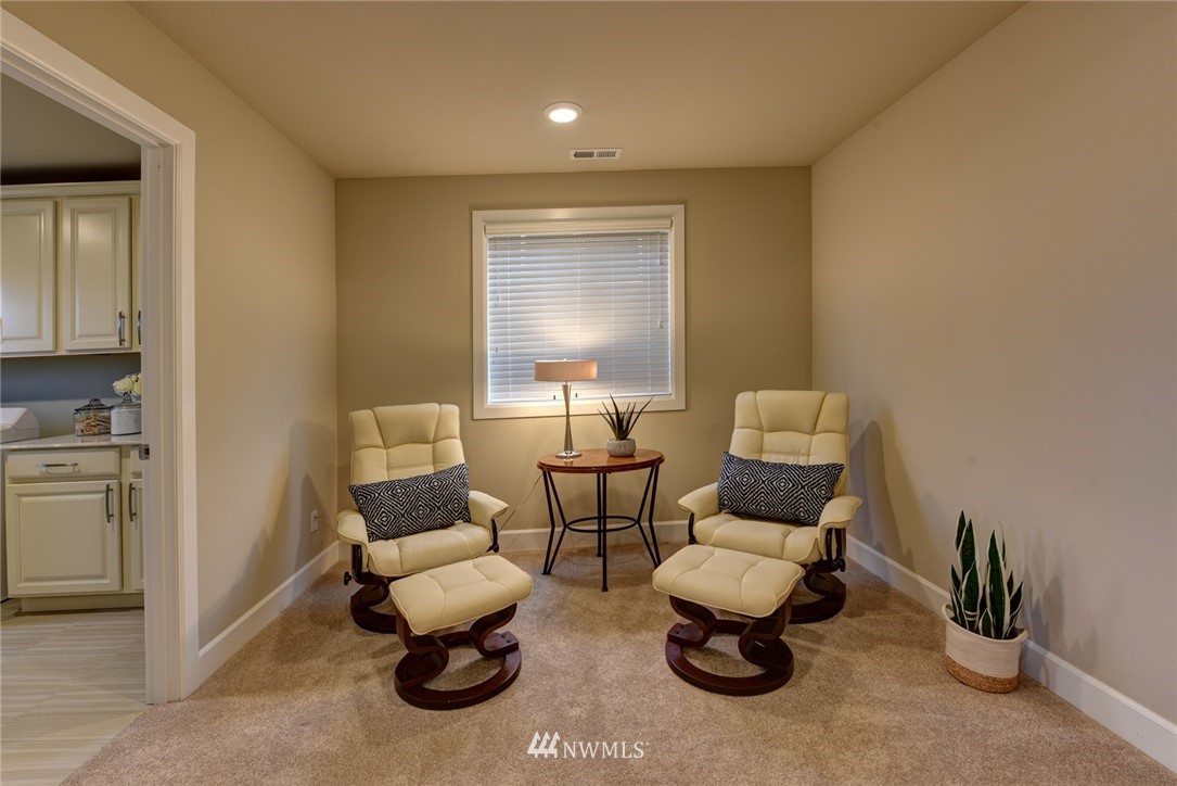 4130 174th Street Southeast Bothell, WA 98012 - Photo 19 of 29 a living room with furniture and a lamp