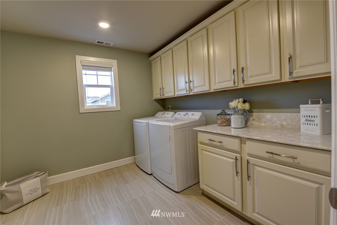 4130 174th Street Southeast Bothell, WA 98012 - Photo 20 of 29 a utility room with closet dryer and washer