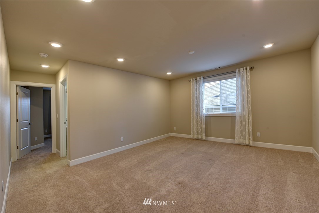 4130 174th Street Southeast Bothell, WA 98012 - Photo 21 of 29 an empty room with windows