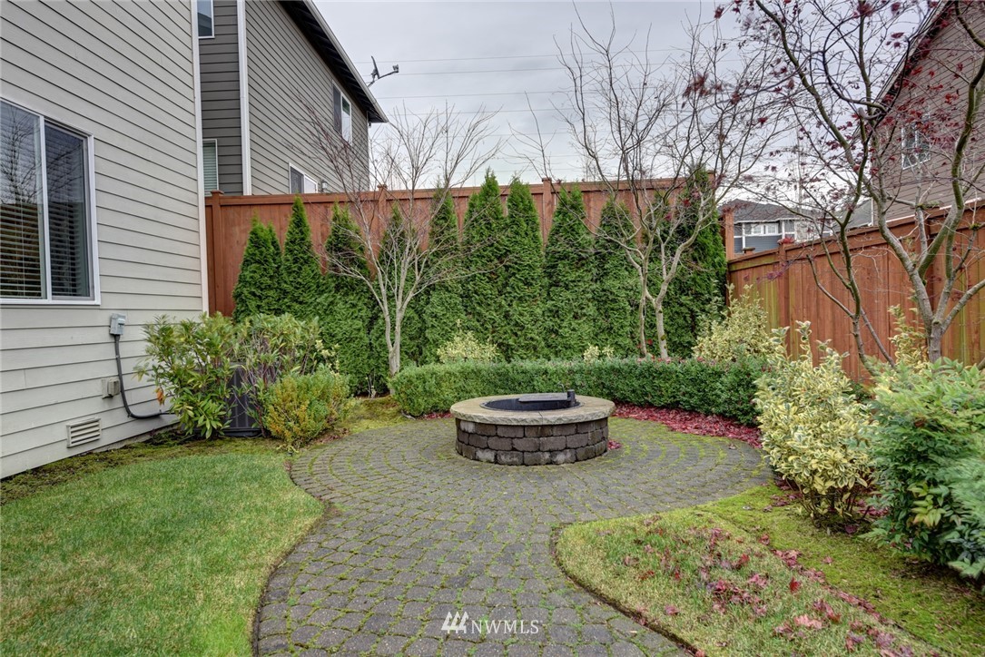 4130 174th Street Southeast Bothell, WA 98012 - Photo 25 of 29 a view of a backyard with plants and outdoor seating