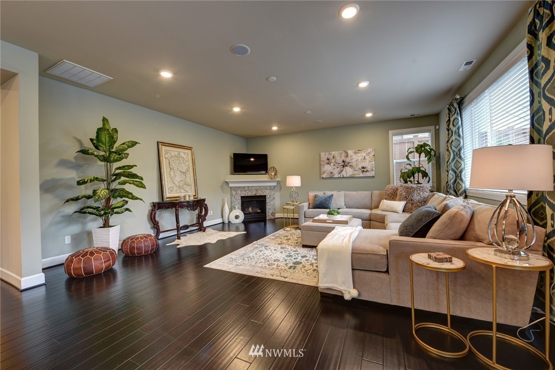 4130 174th Street Southeast Bothell, WA 98012 - Photo 6 of 29 a living room with furniture and a wooden floor