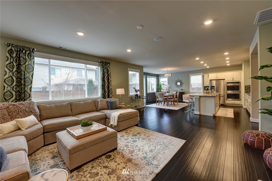 4130 174th Street Southeast Bothell, WA 98012 - Photo 7 of 29 a living room with furniture and a large window