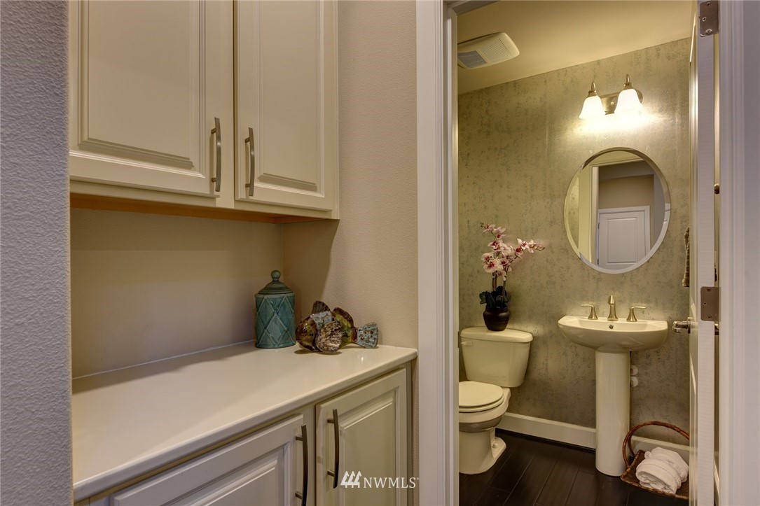 4130 174th Street Southeast Bothell, WA 98012 - Photo 8 of 29 a bathroom with a toilet a sink and mirror