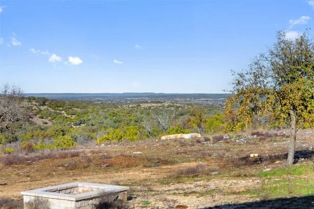 a view of an ocean beach and mountain