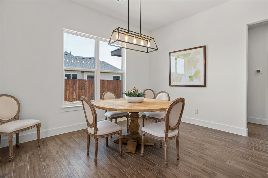 204 Cliff Court Godley, TX 76044 - Photo 12 of 27 a view of a dining room with furniture window and wooden floor