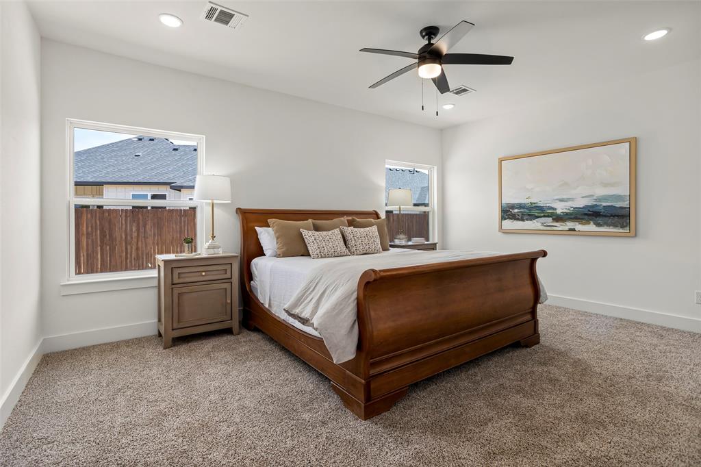 204 Cliff Court Godley, TX 76044 - Photo 14 of 27 a bedroom with a bed and a chandelier
