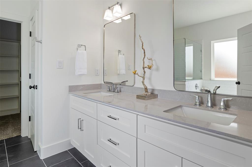 204 Cliff Court Godley, TX 76044 - Photo 16 of 27 a bathroom with double vanity sink and a mirror