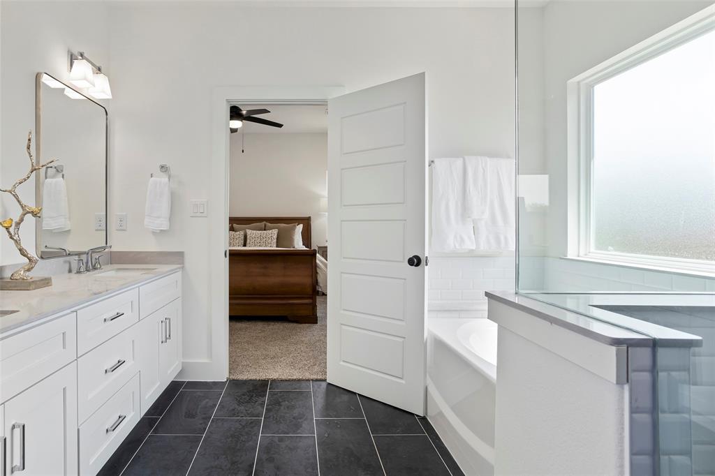 204 Cliff Court Godley, TX 76044 - Photo 18 of 27 a bathroom with a sink and a mirror