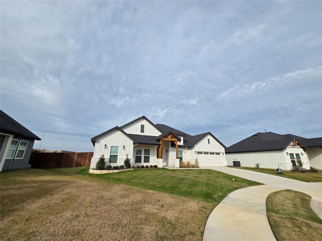 204 Cliff Court Godley, TX 76044 - Photo 27 of 27 a front view of a house with a yard and garage
