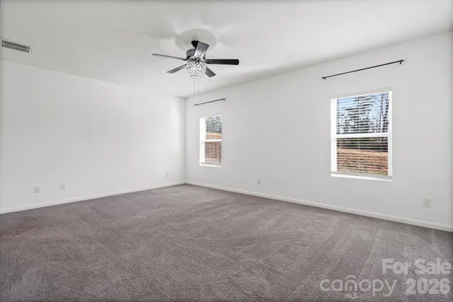 a bathroom with a double vanity sink toilet and shower