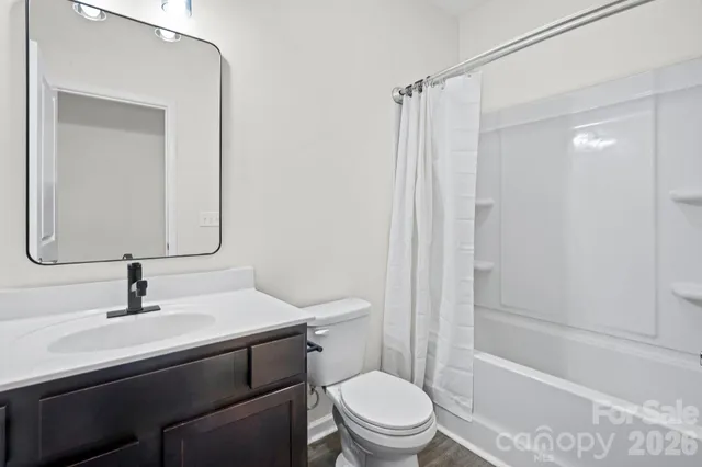 a sign broad on the side of a road