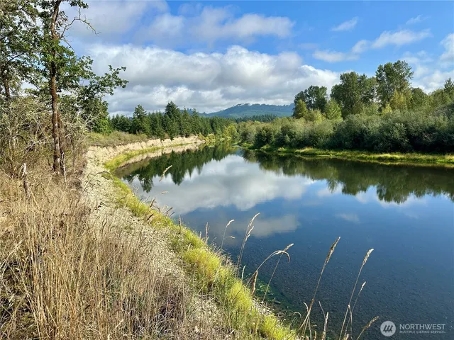 a view of a lake with houses in the back