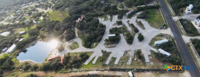 582 Adolfo Road Aransas Pass, TX 78336 - Photo 1 of 1 Cleared areas for building that are presently set up for RV's