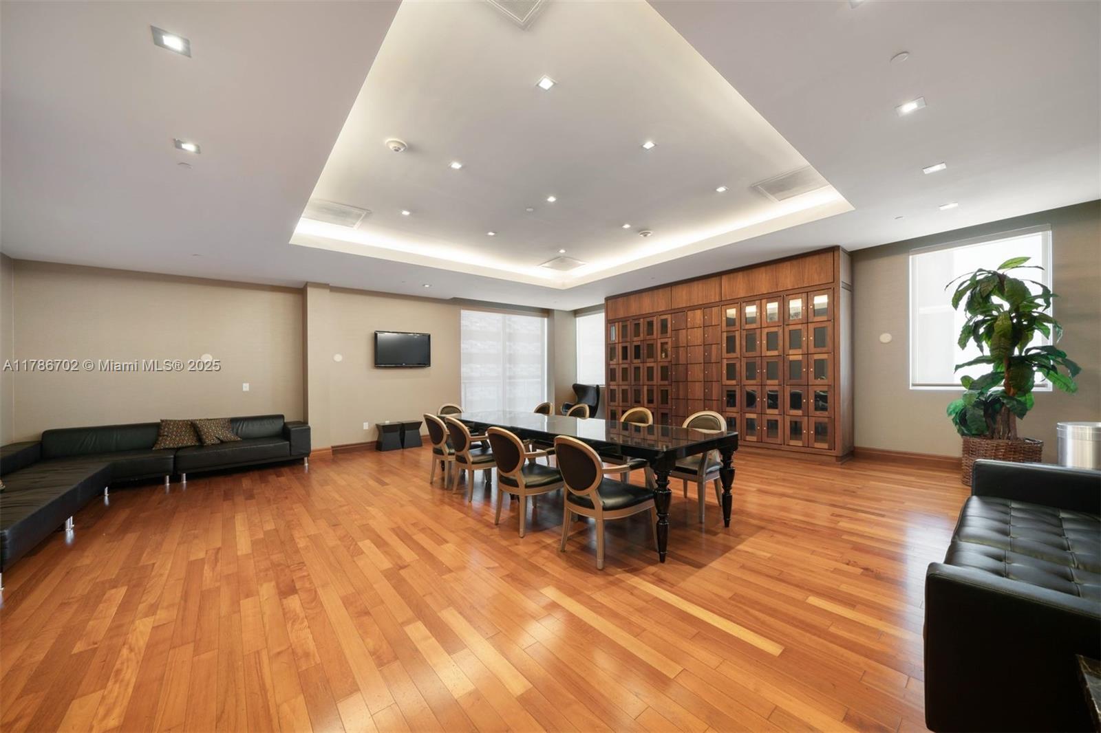 1060 Brickell Avenue, Unit 3003 Miami, FL 33131 - Photo 35 of 39 a view of a dining room with furniture window and wooden floor