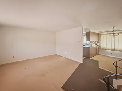 a kitchen with a sink cabinets and stainless steel appliances